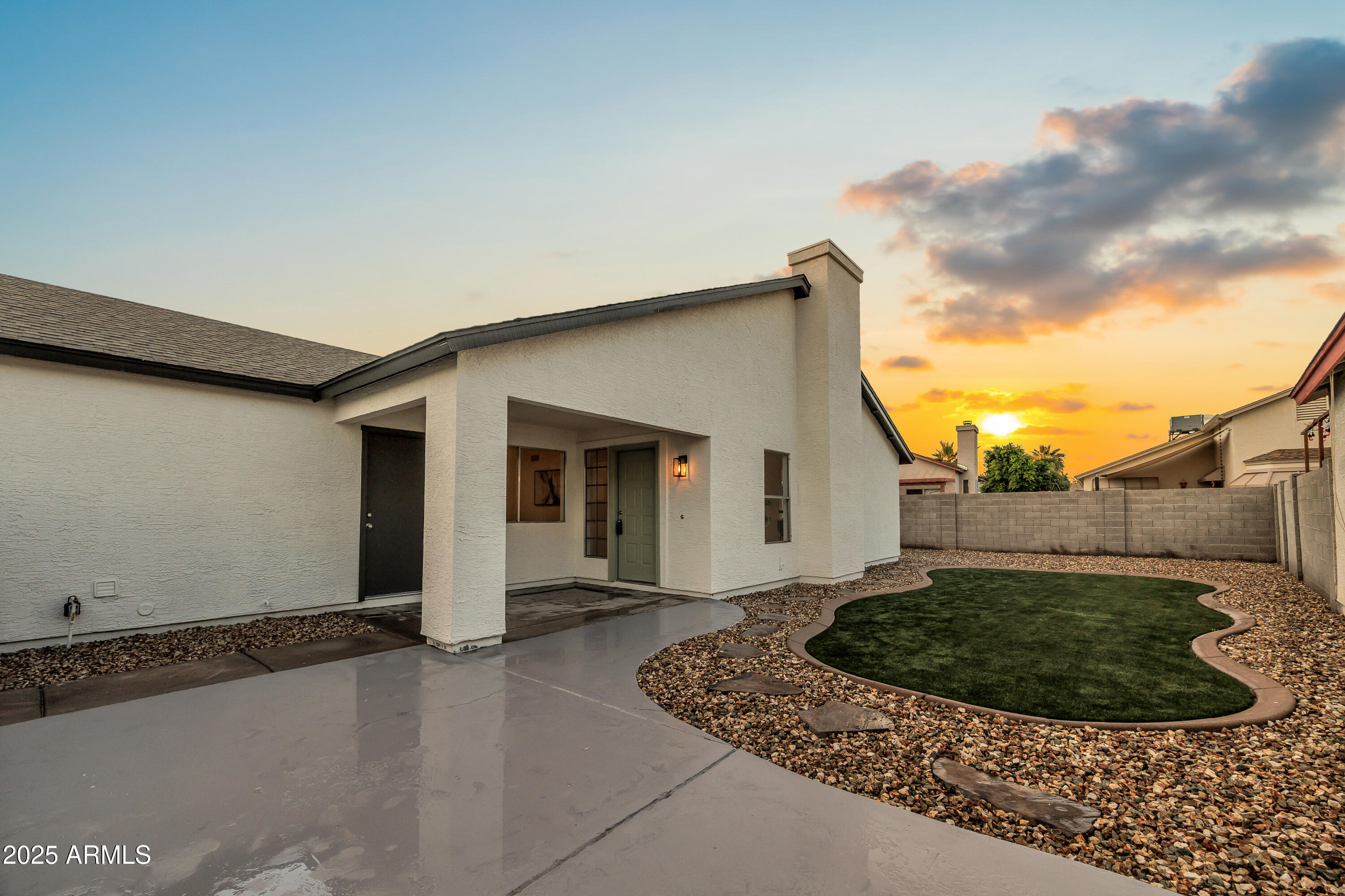 8830 West St John Road Peoria, AZ 85382 - Photo 23 of 25 a view of a house with a yard