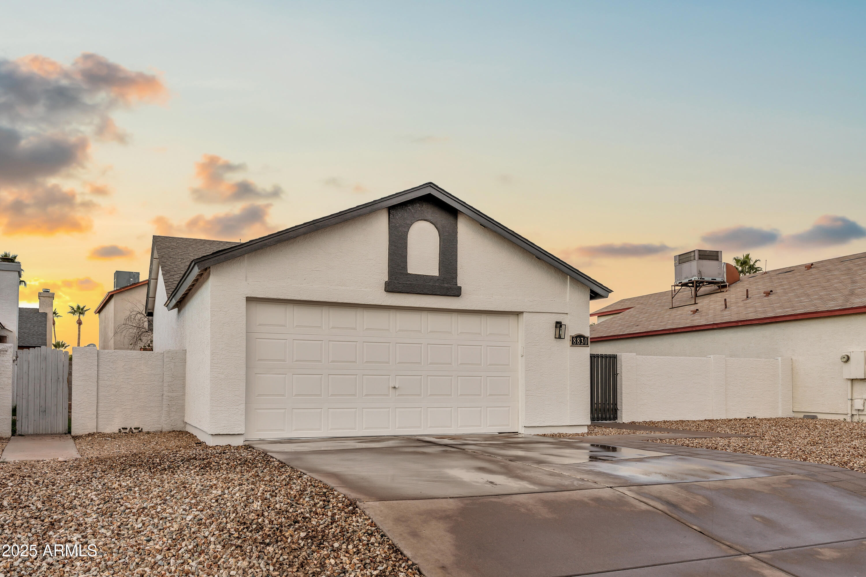 8830 West St John Road Peoria, AZ 85382 - Photo 3 of 25 a front view of a house with a yard