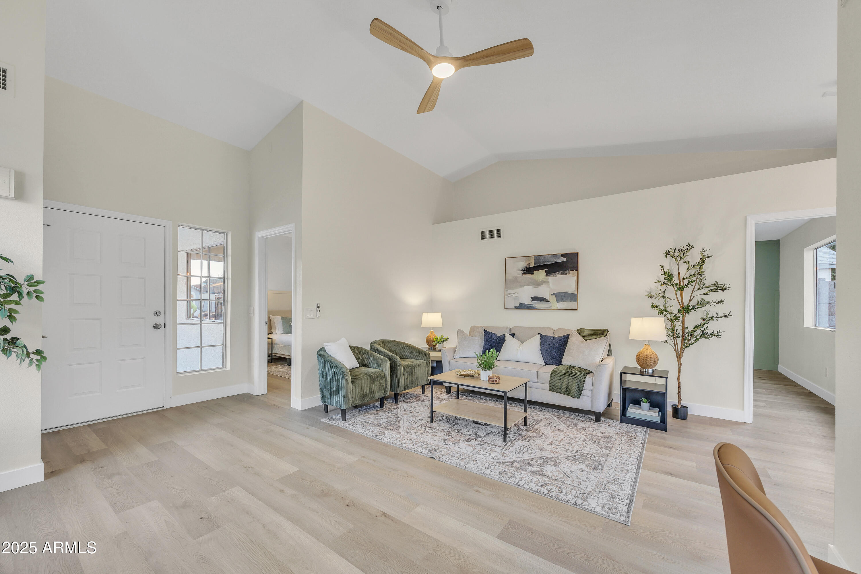 8830 West St John Road Peoria, AZ 85382 - Photo 5 of 25 a living room with furniture