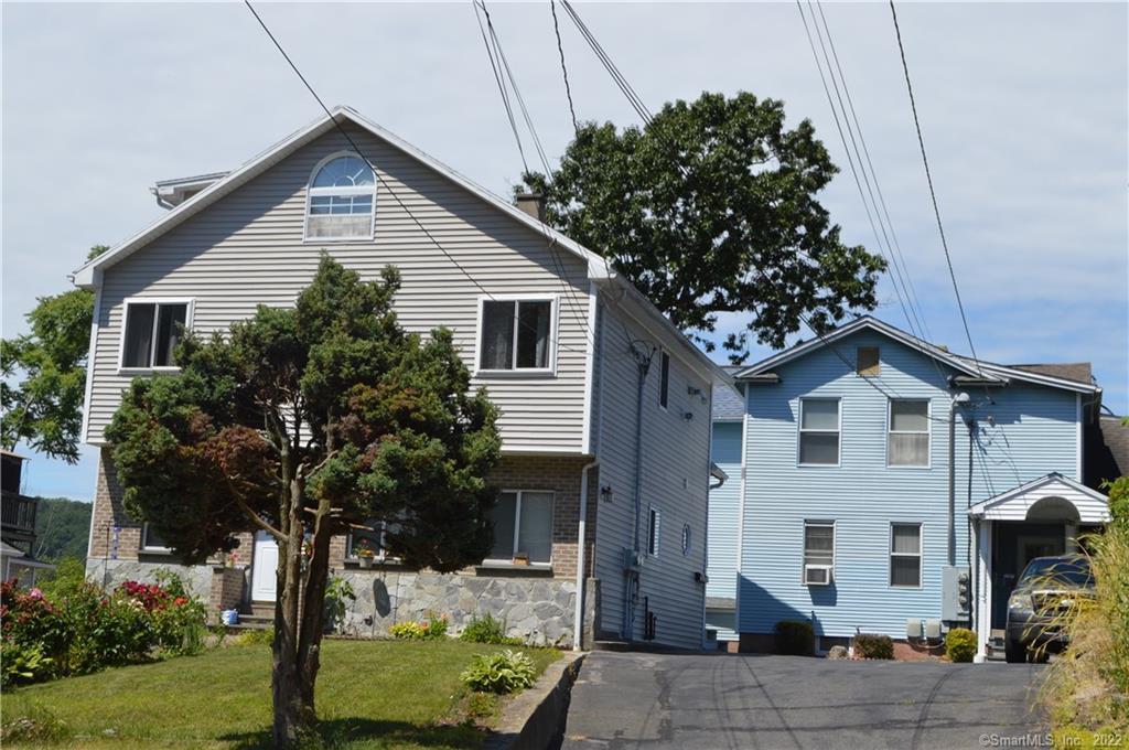 42 High Street Naugatuck, CT 06770 - Photo 1 of 1 a view of a house with yard and plants