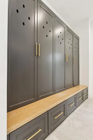 a bathroom with a double vanity sink and mirror