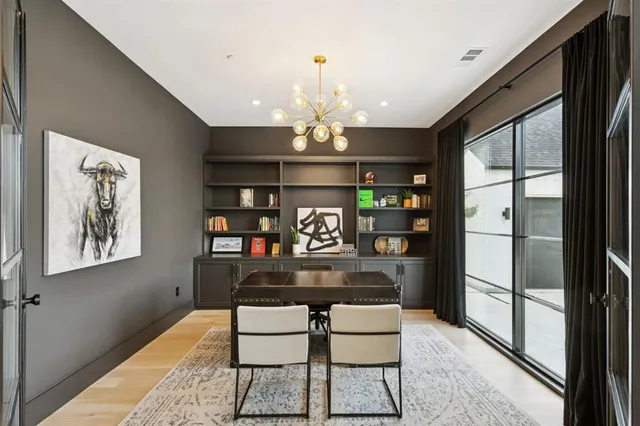 a view of a livingroom with furniture cabinet and a window