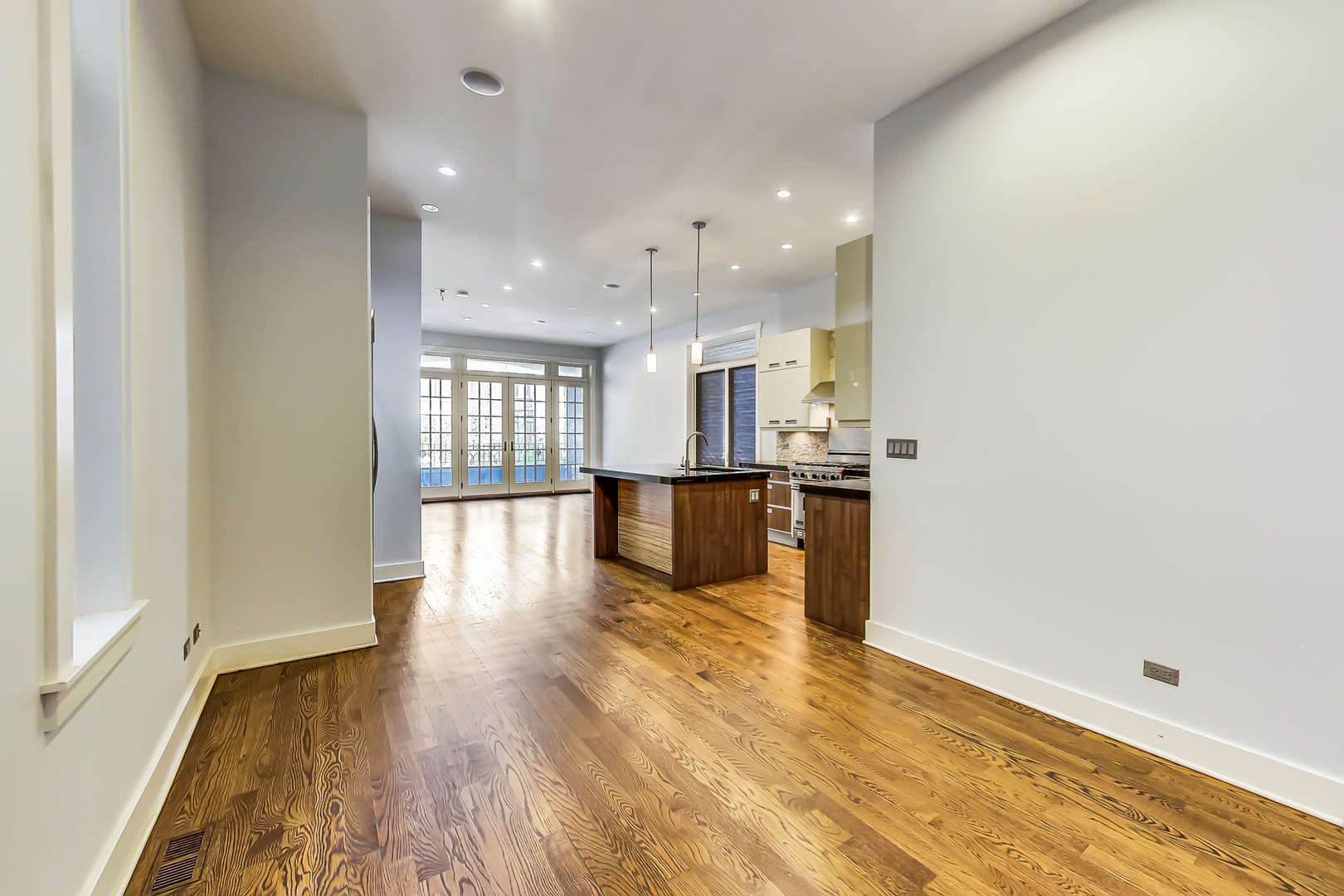 619 West Surf Street, Unit 1 Chicago, IL 60657 - Photo 16 of 36 a view of a kitchen with wooden floor