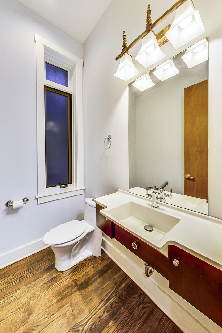 619 West Surf Street, Unit 1 Chicago, IL 60657 - Photo 17 of 36 a bathroom with a sink and a mirror