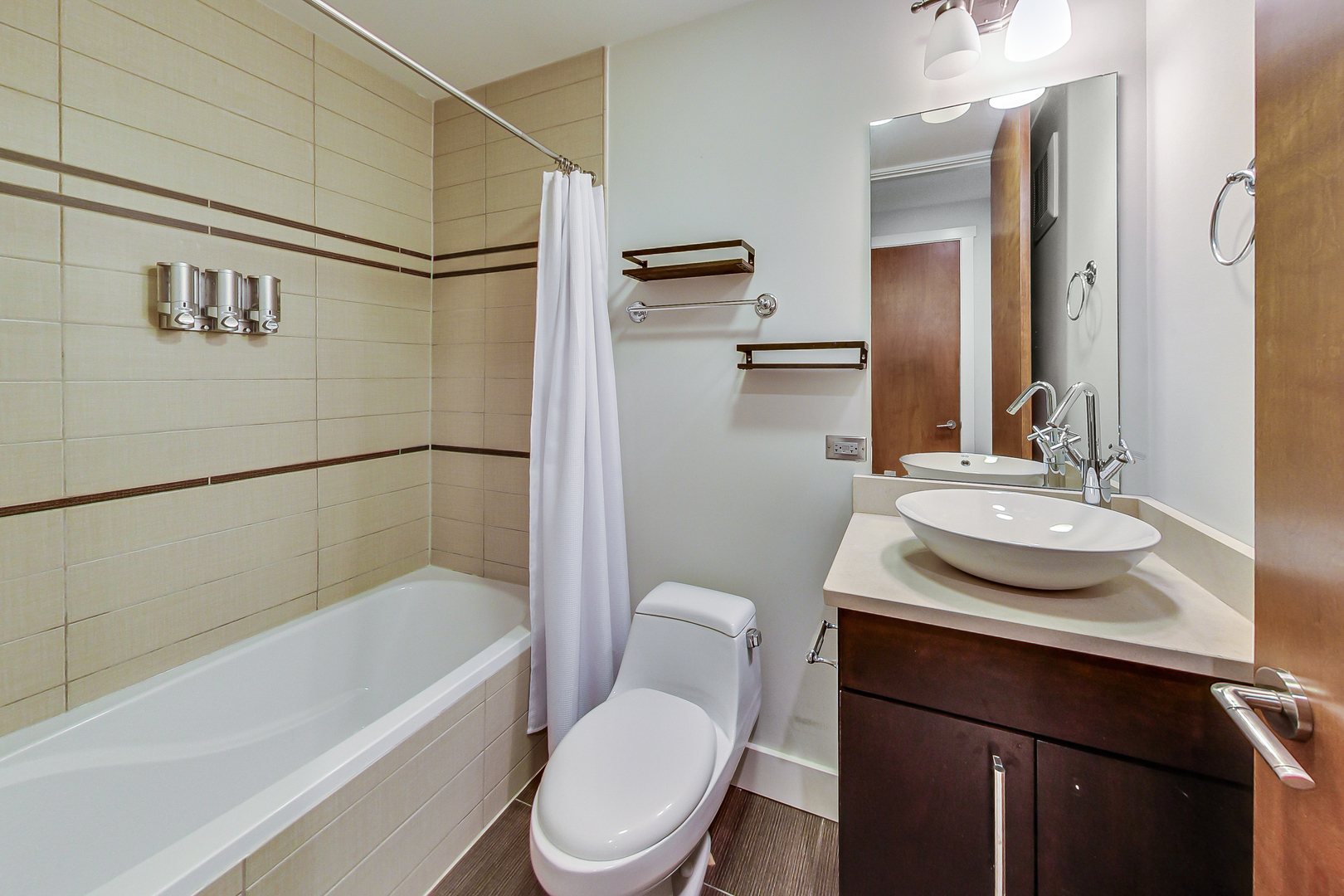 619 West Surf Street, Unit 1 Chicago, IL 60657 - Photo 19 of 36 a bathroom with a granite countertop sink toilet and shower