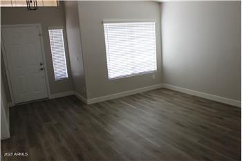13402 East Boston Street Chandler, AZ 85225 - Photo 15 of 19 an empty room with wooden floor and windows
