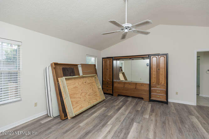 303 Genoa Road St. Augustine, FL 32084 - Photo 18 of 22 a view of room with window and ceiling fan