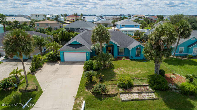 303 Genoa Road St. Augustine, FL 32084 - Photo 3 of 22 front view of a house with a yard