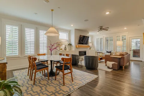a view of a dining room with furniture window and wooden floor