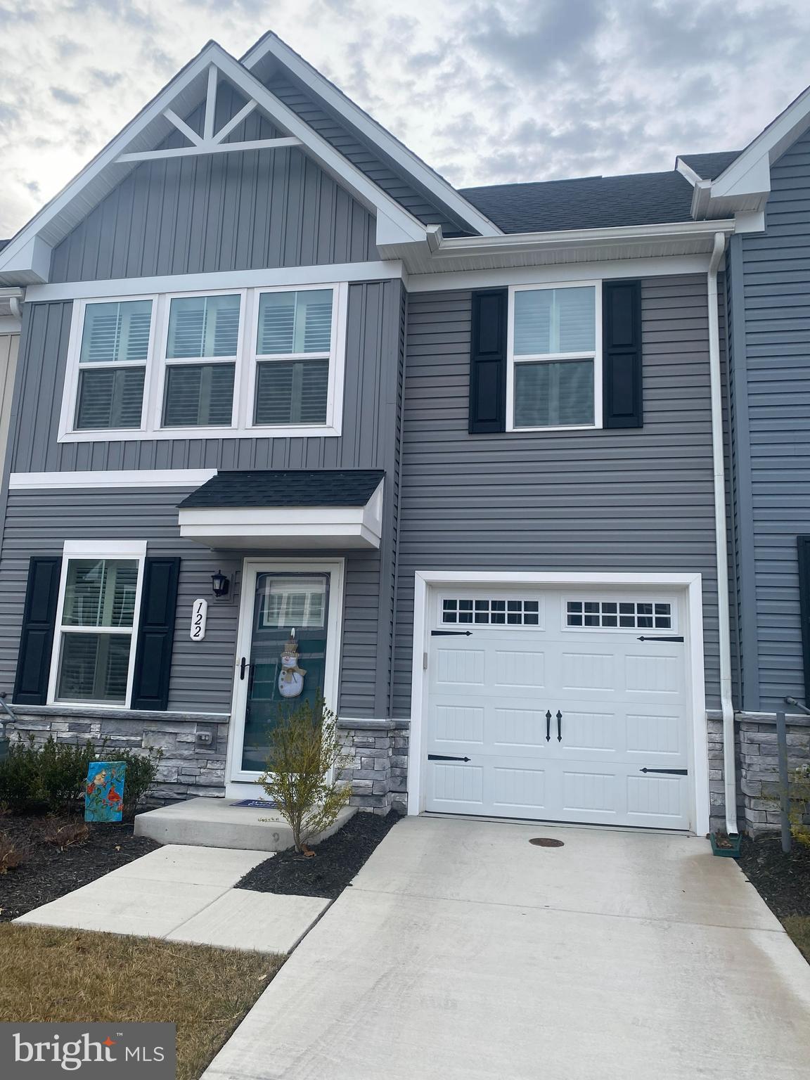 a front view of a house with garage