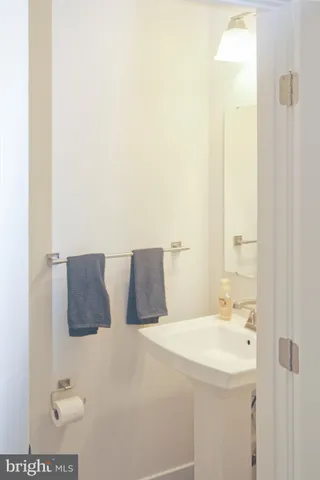 a bathroom with a double vanity sink and mirror