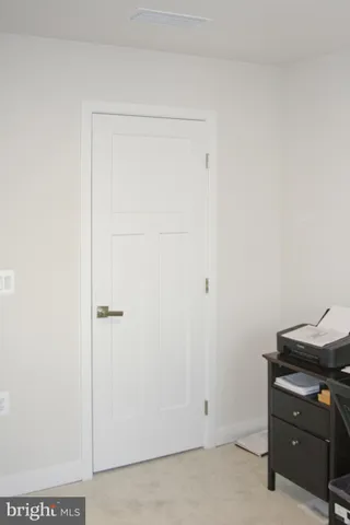 a view of room with hardwood floor