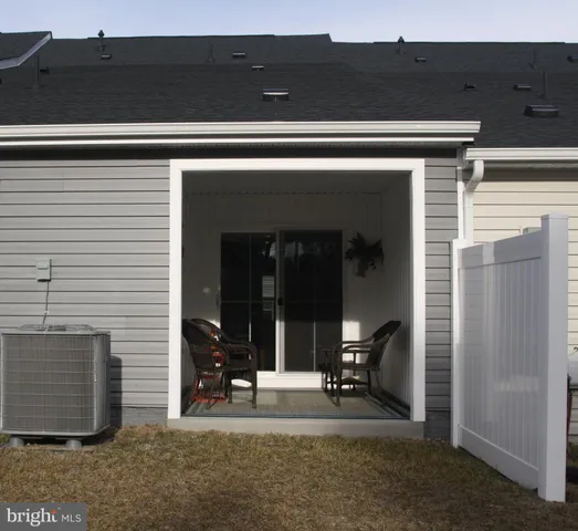 a view of house with chair and entryway