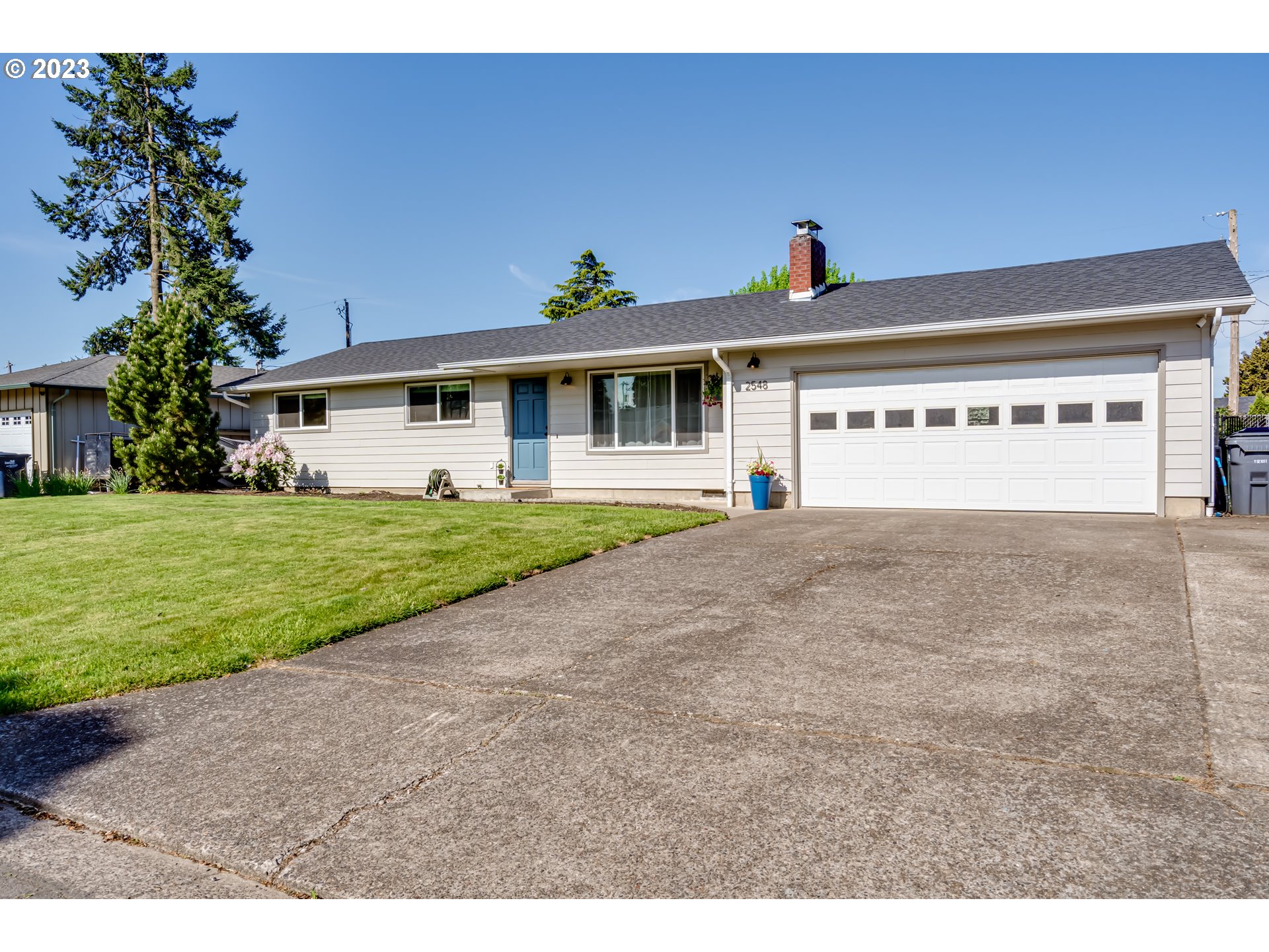 2548 16th Street Springfield, OR 97477 - Photo 1 of 35 a view of a house with a yard and potted plants