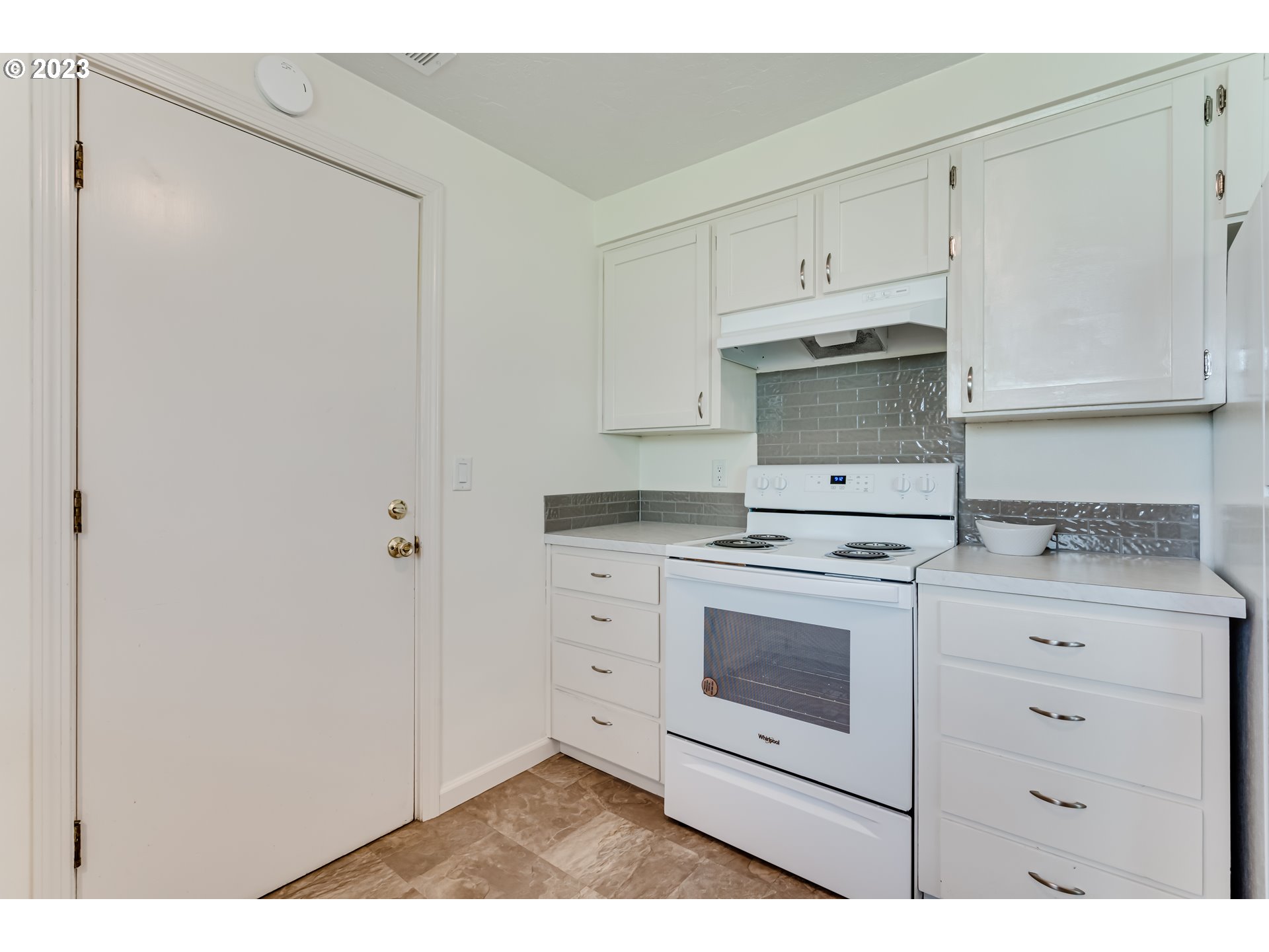2548 16th Street Springfield, OR 97477 - Photo 13 of 35 a kitchen with white cabinets and white appliances