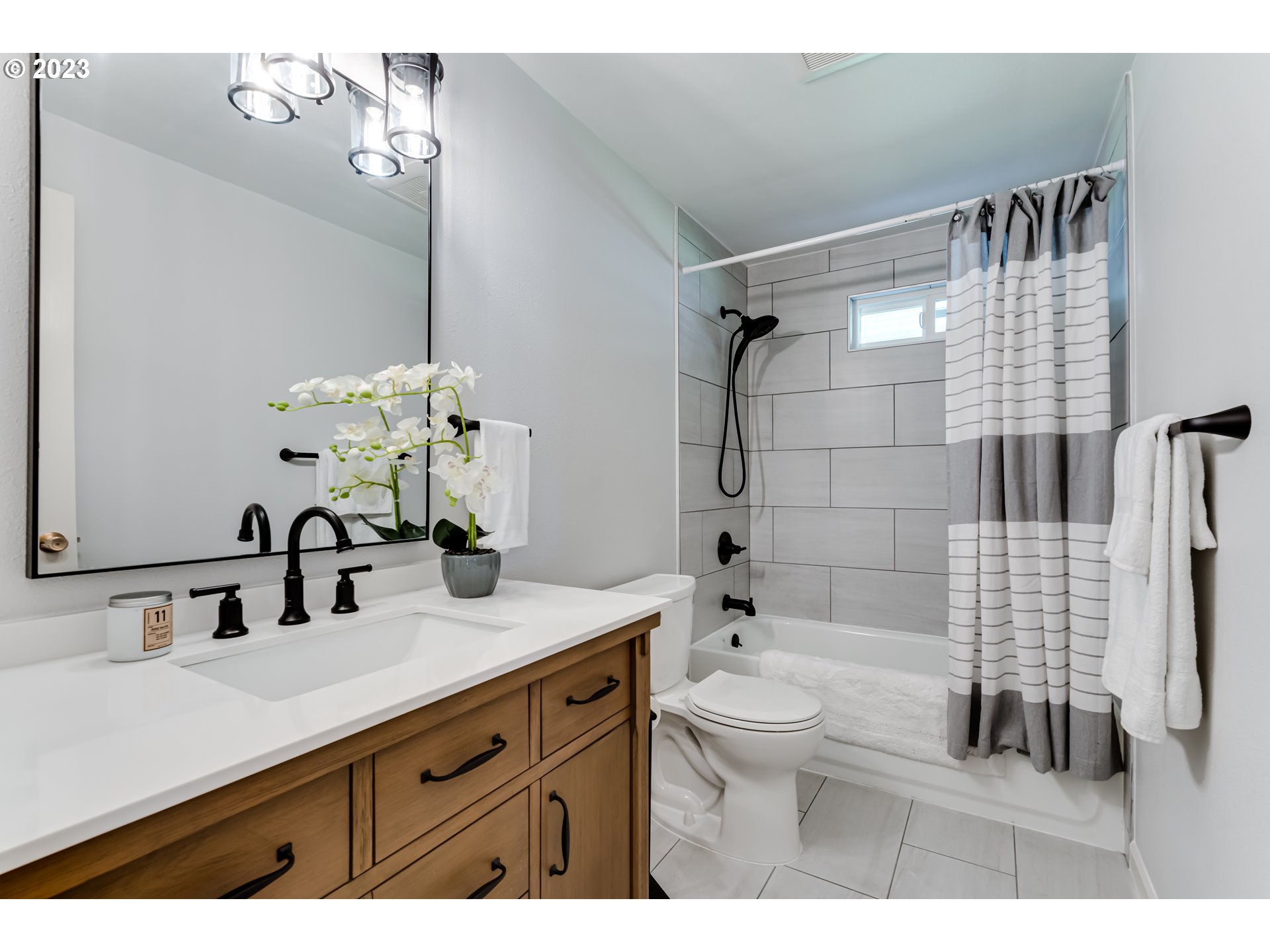 2548 16th Street Springfield, OR 97477 - Photo 15 of 35 a bathroom with a sink double vanity granite toilet and shower