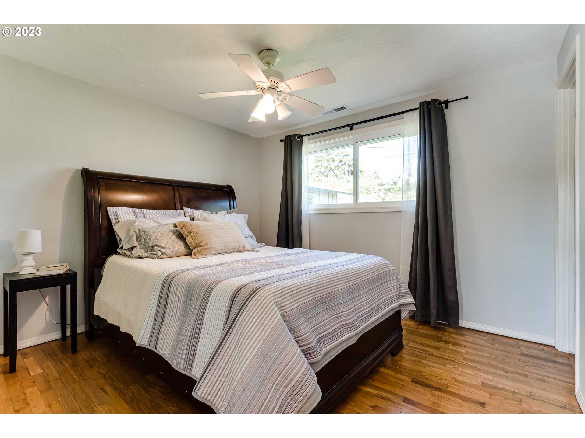 2548 16th Street Springfield, OR 97477 - Photo 18 of 35 a bedroom with a bed and a window