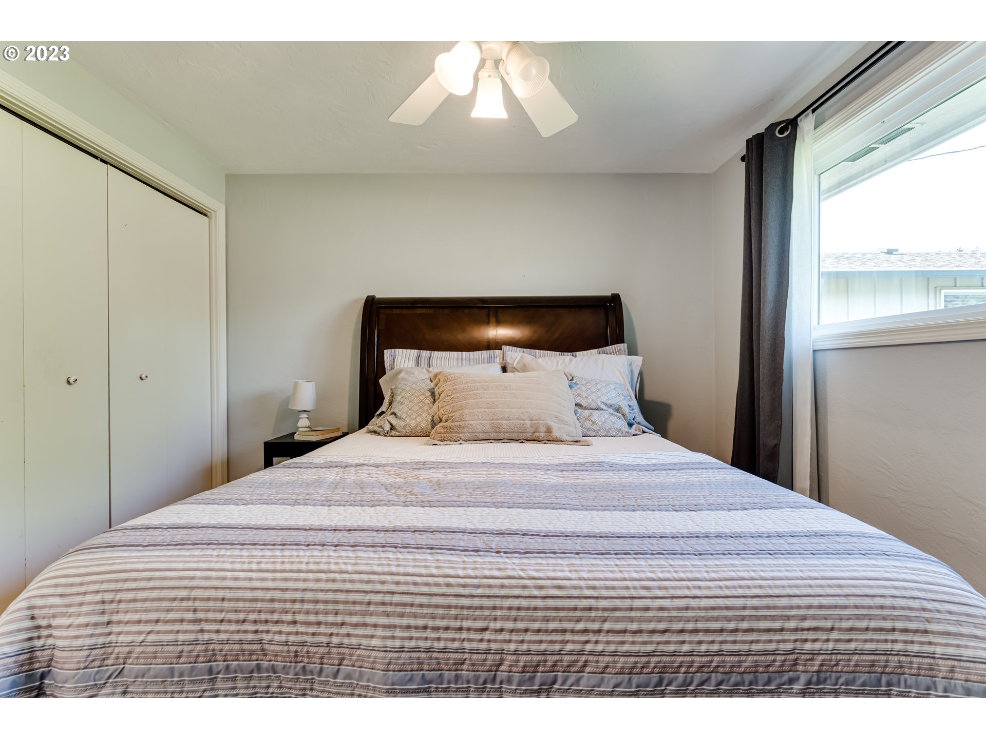 2548 16th Street Springfield, OR 97477 - Photo 19 of 35 a bedroom with a bed and a window