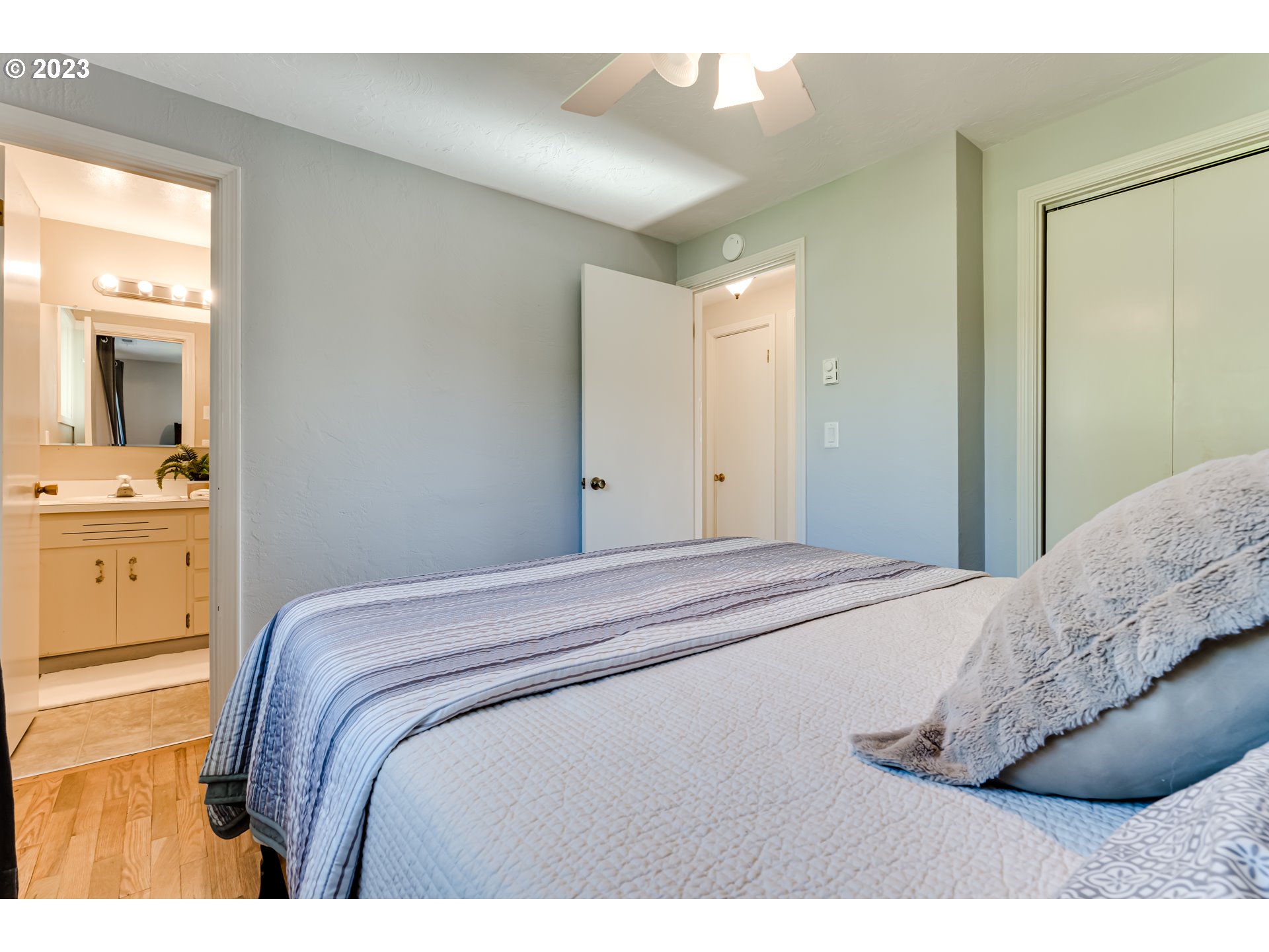 2548 16th Street Springfield, OR 97477 - Photo 20 of 35 a bedroom with a bed and a cabinets