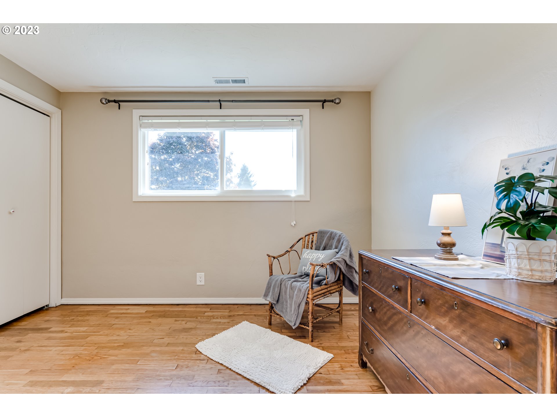 2548 16th Street Springfield, OR 97477 - Photo 25 of 35 a room with a window and a potted plant on table