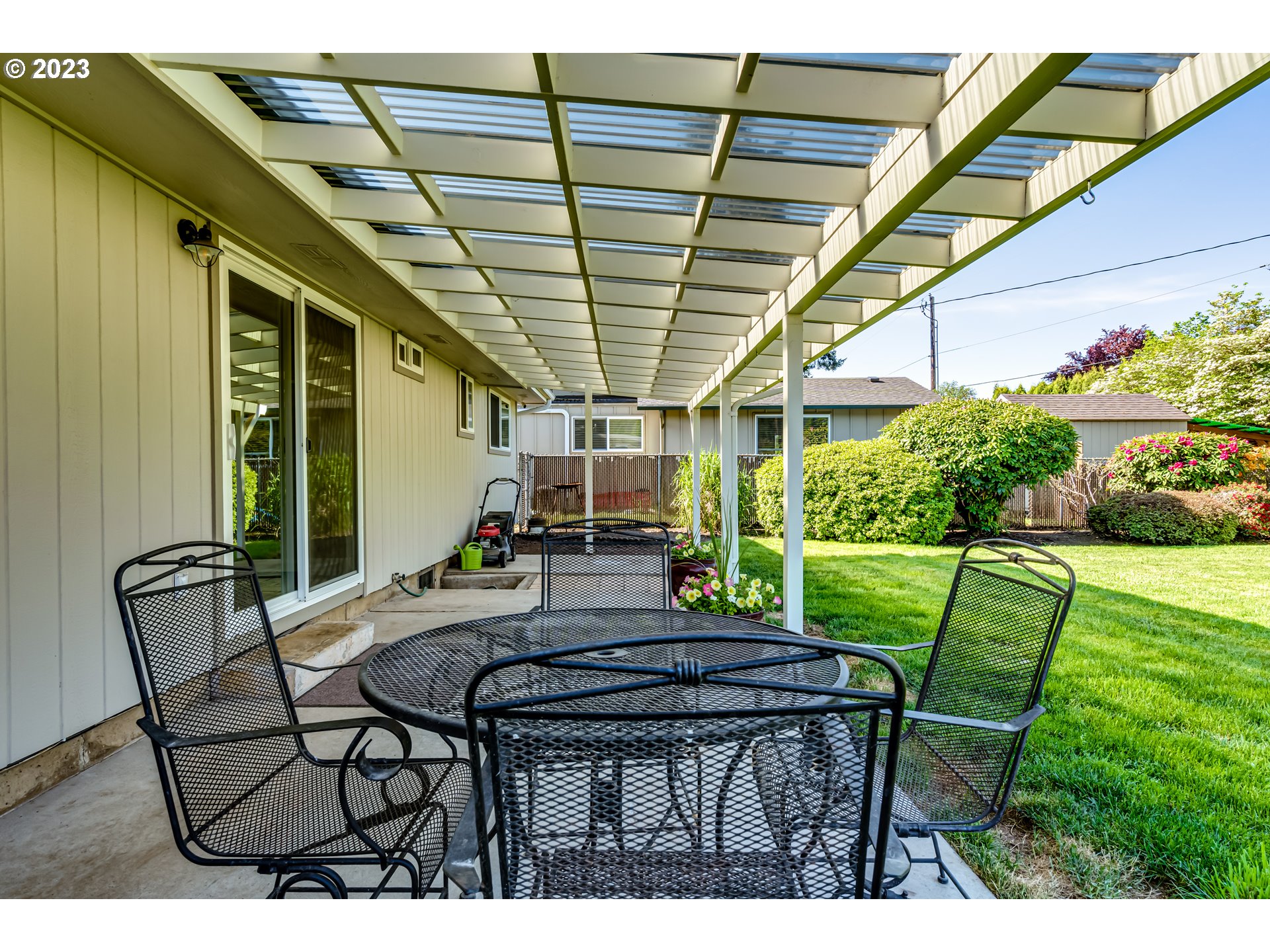 2548 16th Street Springfield, OR 97477 - Photo 28 of 35 a view of patio with table and chairs and potted plants