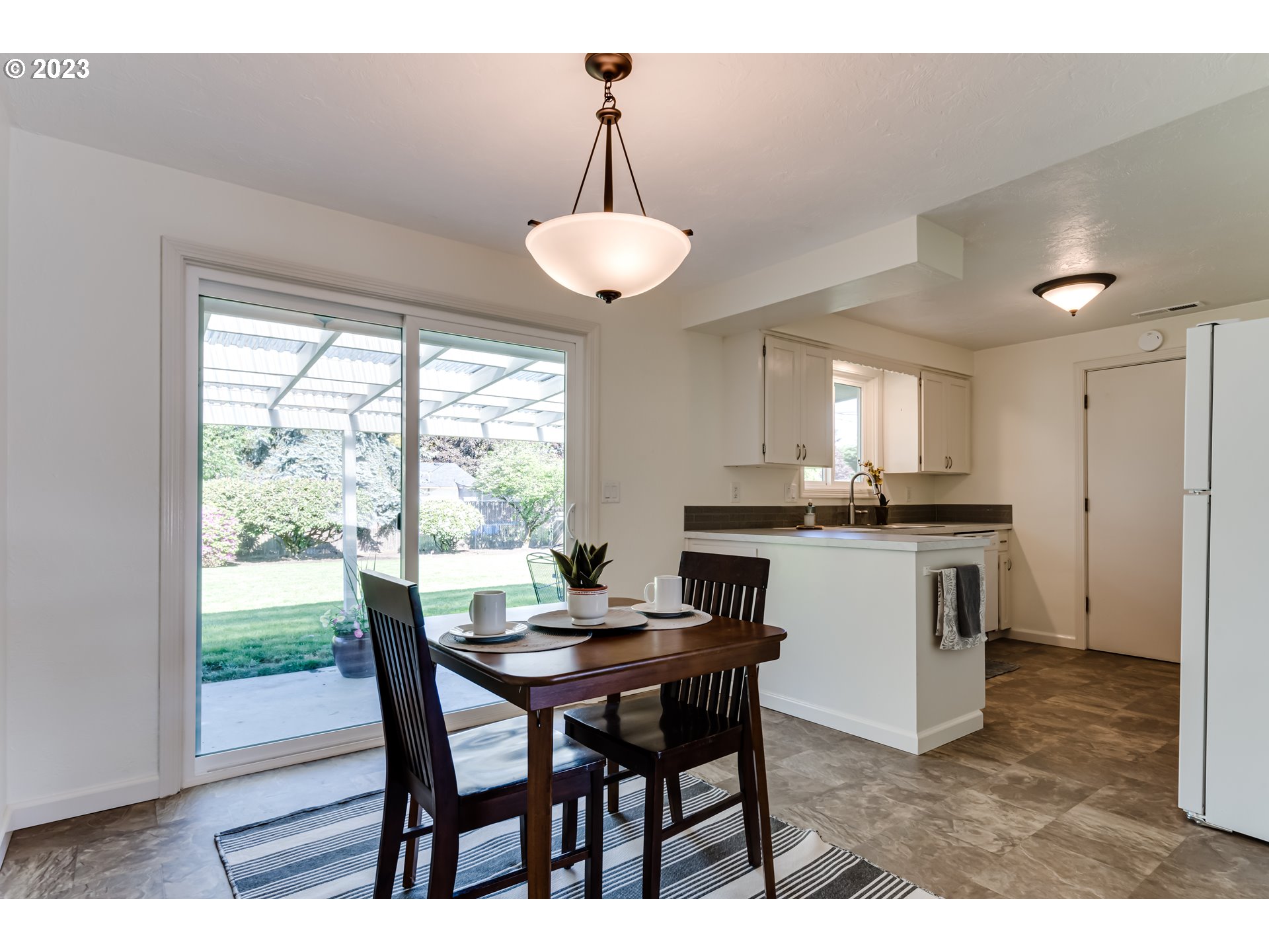 2548 16th Street Springfield, OR 97477 - Photo 7 of 35 a view of a dining room with furniture window and outside view