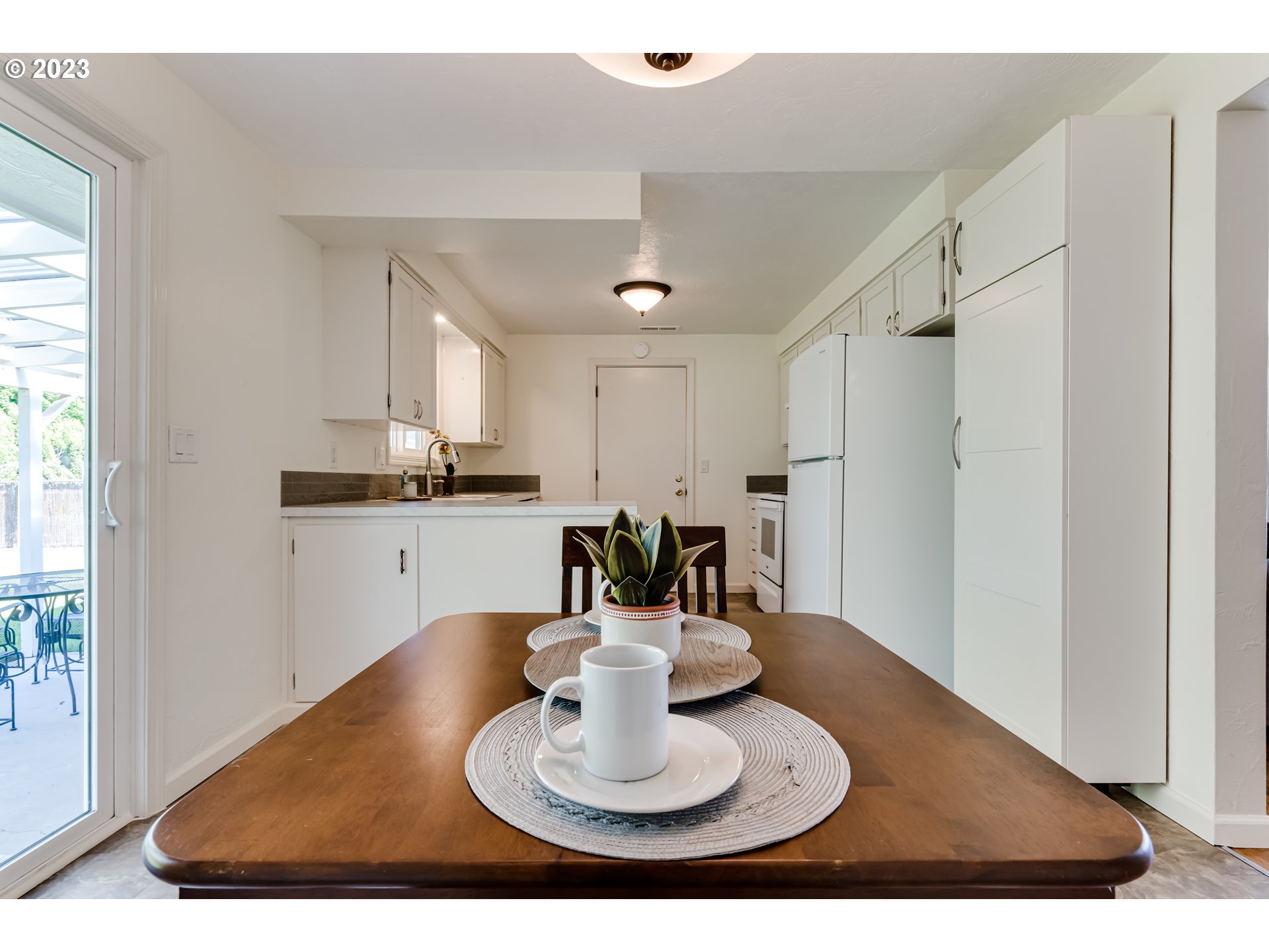 2548 16th Street Springfield, OR 97477 - Photo 9 of 35 a kitchen with a refrigerator and a sink