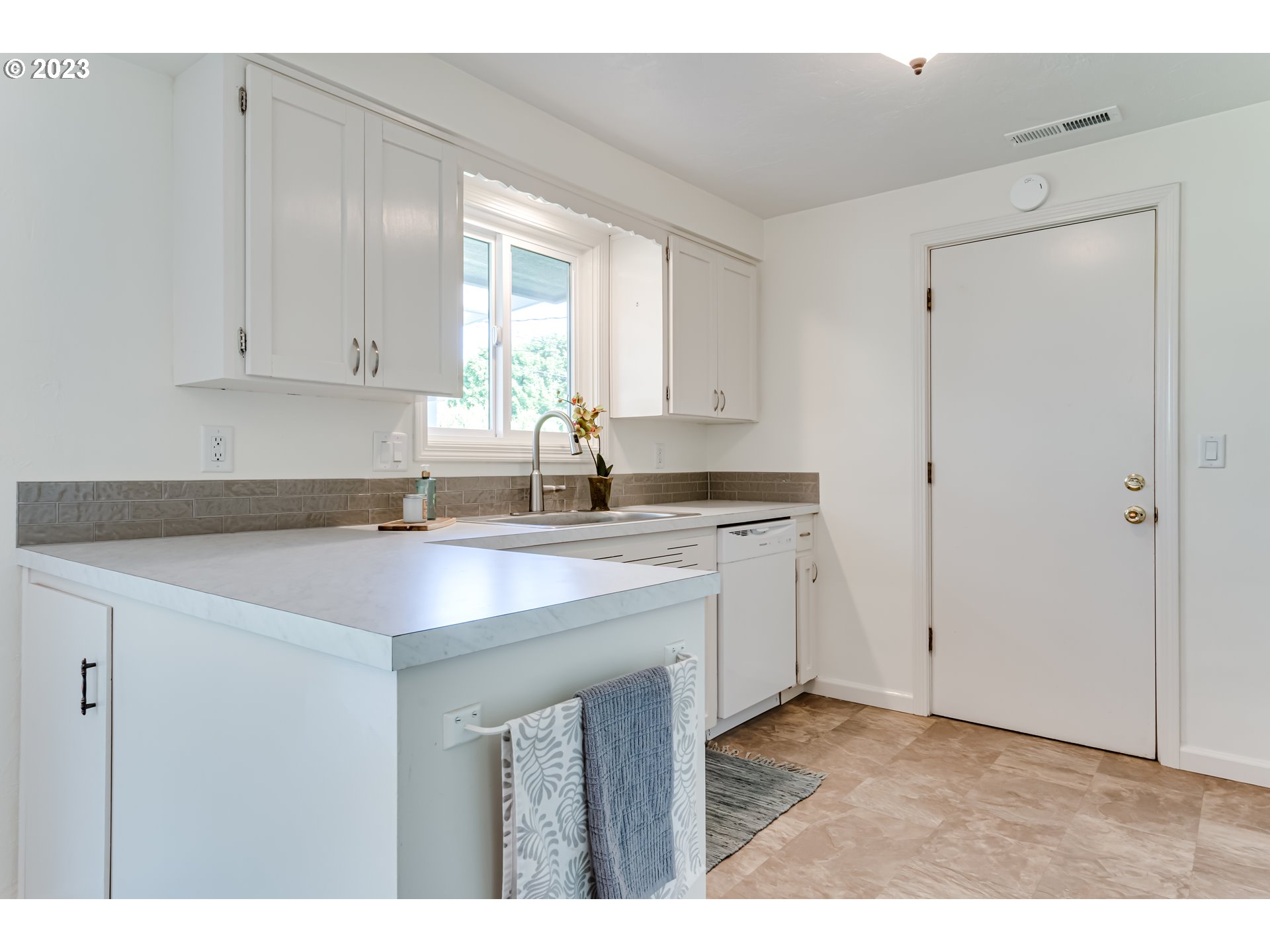 2548 16th Street Springfield, OR 97477 - Photo 10 of 35 a kitchen with a sink cabinets and window