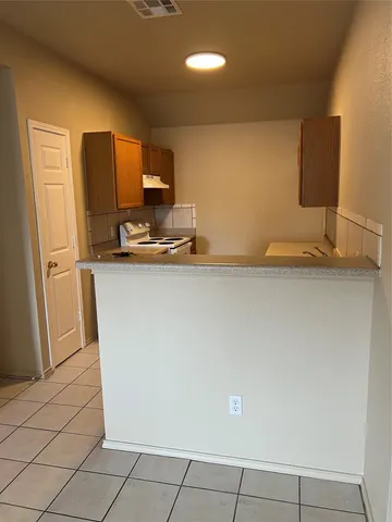 a view of a kitchen with a sink