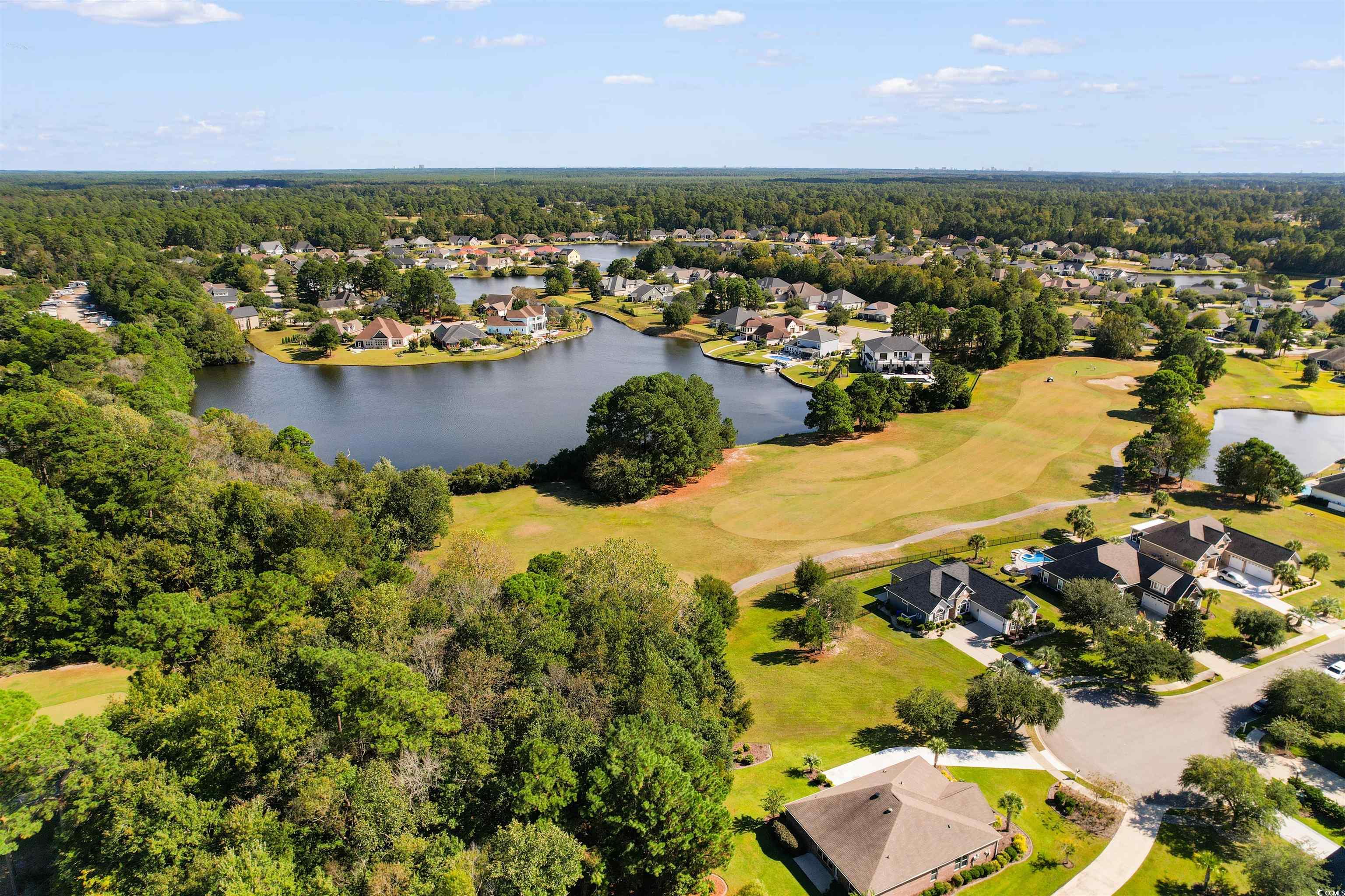 1005 Whooping Crane Drive Conway, SC 29526 - Photo 8 of 35 Aerial perspective of suburban area featuring a golf course and a large body of water