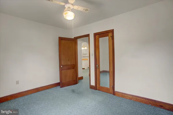 an empty room with a bathroom