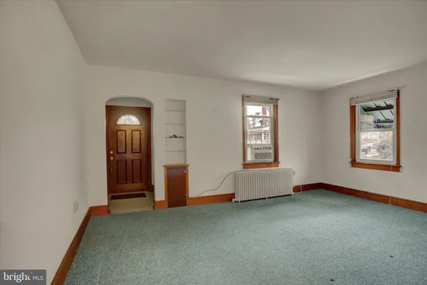 an empty room with windows