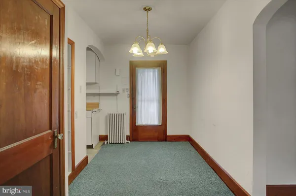 a view of a hallway with windows
