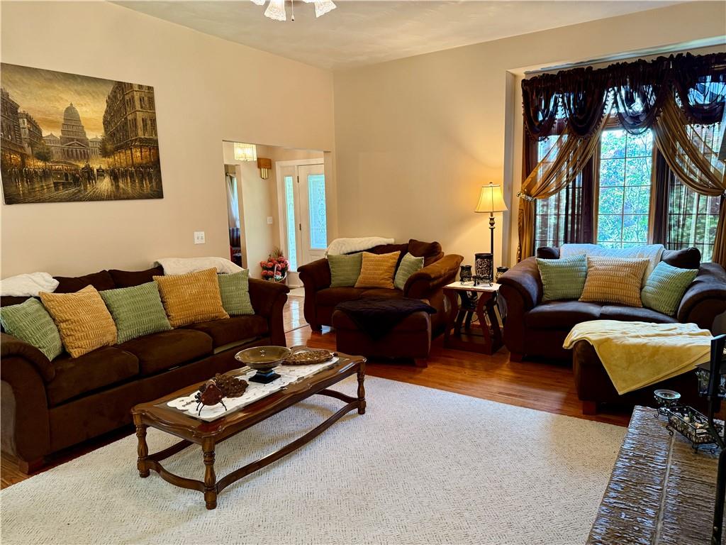 293 Sandy Hill Road Valencia, PA 16059 - Photo 24 of 50 a living room with furniture a large window and a table