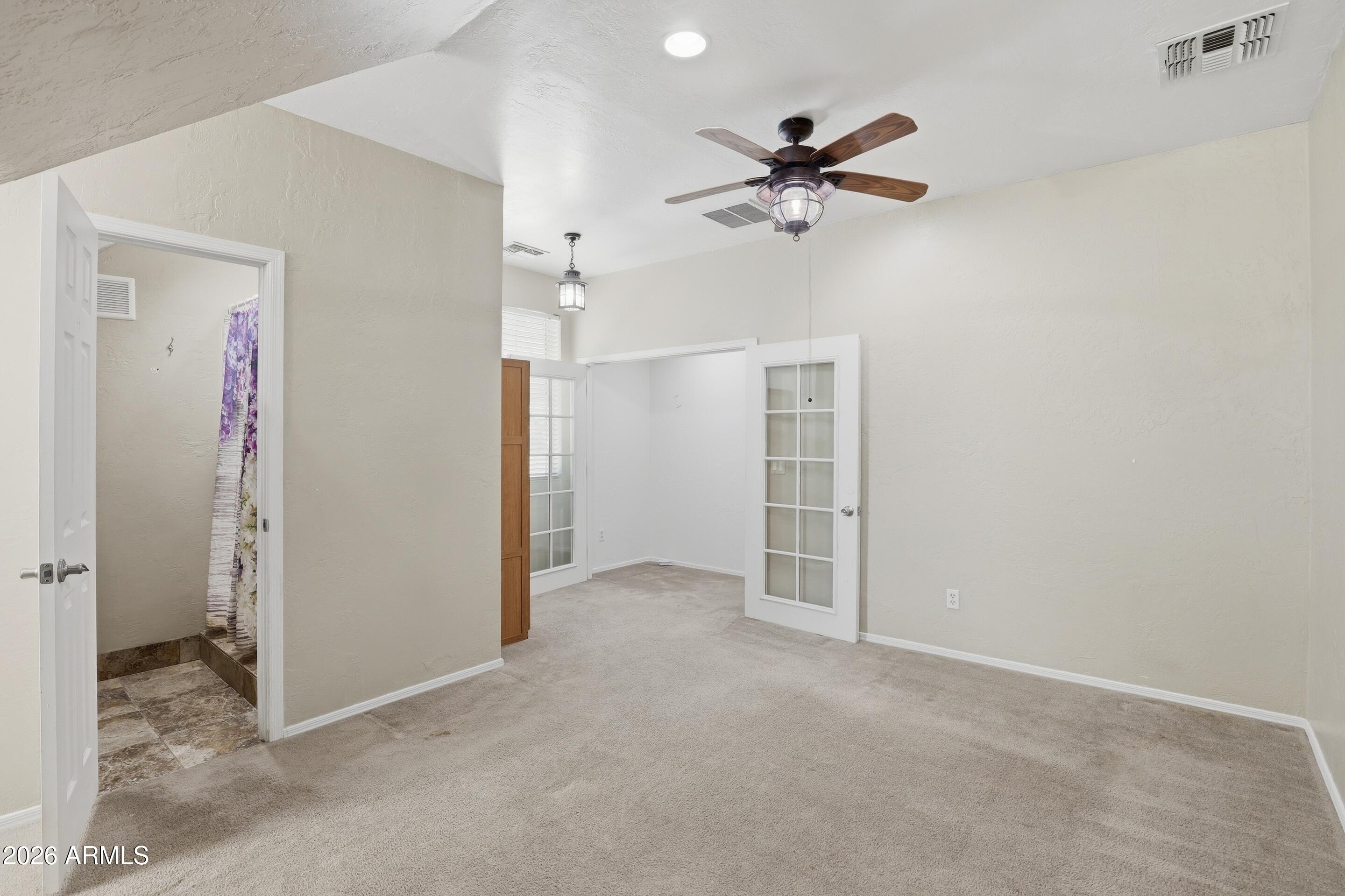 228 Windmill Road Payson, AZ 85541 - Photo 30 of 42 a view of a livingroom with a ceiling fan and closet area