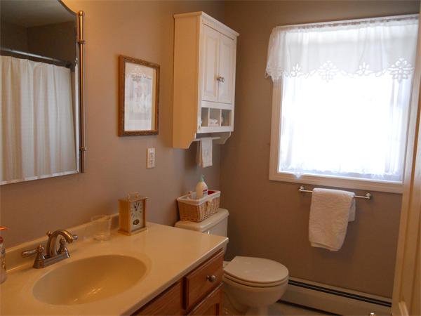 60 Beachview Road Lunenburg, MA 01462 - Photo 12 of 18 a bathroom with a sink toilet a mirror and shower