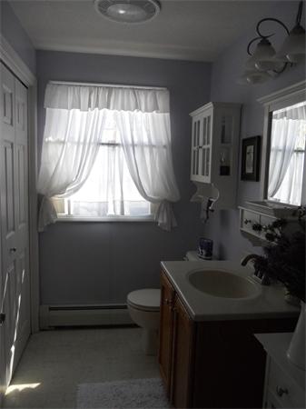 60 Beachview Road Lunenburg, MA 01462 - Photo 13 of 18 a bathroom with a sink a toilet and a mirror