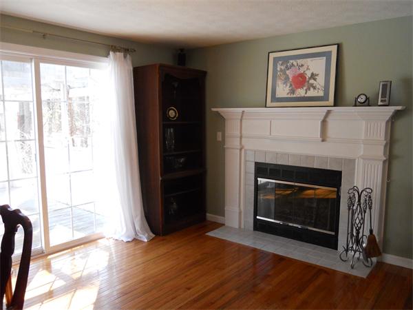 60 Beachview Road Lunenburg, MA 01462 - Photo 4 of 18 a living room with a fireplace with wooden floor