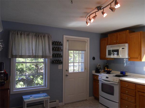 60 Beachview Road Lunenburg, MA 01462 - Photo 7 of 18 a kitchen with a stove a sink and a window