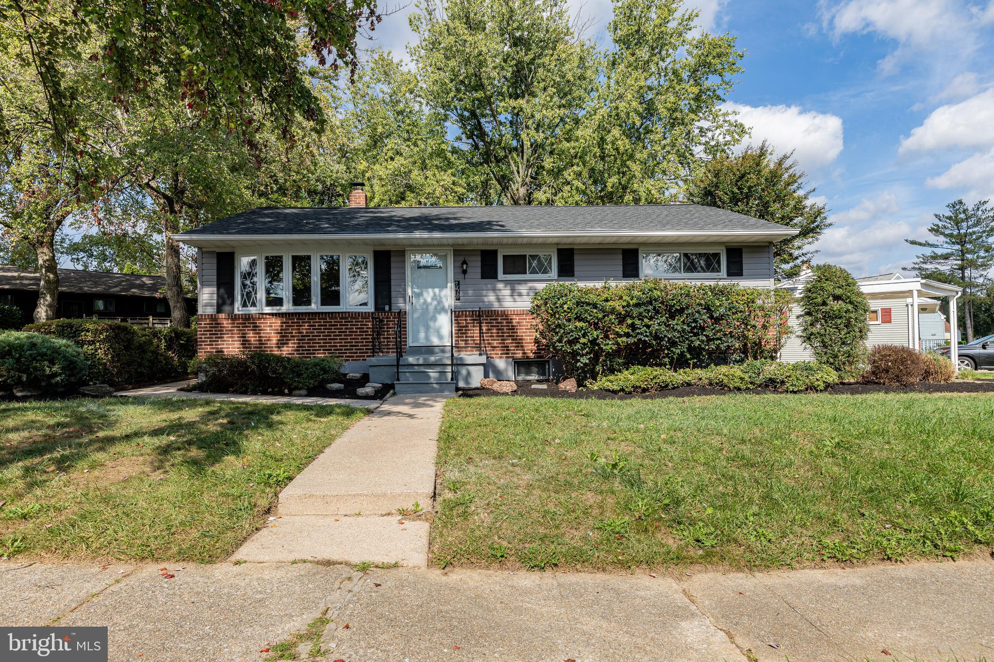 7410 Remoor Road Baltimore, MD 21207 - Photo 1 of 33 front view of a house with a yard