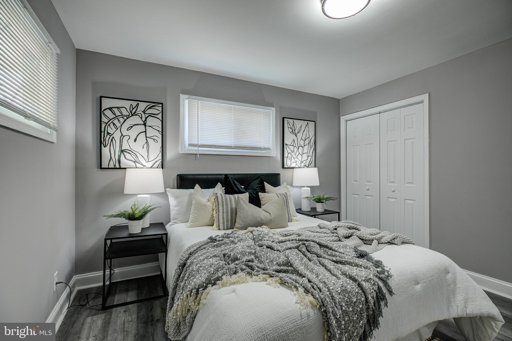 7410 Remoor Road Baltimore, MD 21207 - Photo 17 of 33 a bedroom with a bed and wooden floor