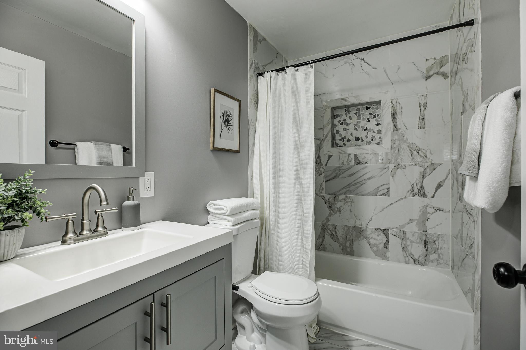 7410 Remoor Road Baltimore, MD 21207 - Photo 18 of 33 a bathroom with a sink toilet and shower