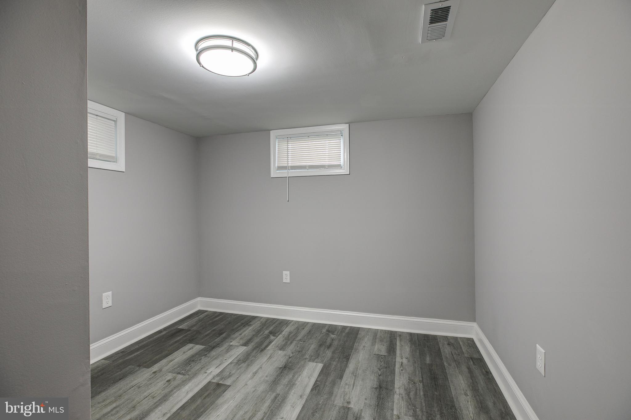 7410 Remoor Road Baltimore, MD 21207 - Photo 27 of 33 a view of an empty room with wooden floor