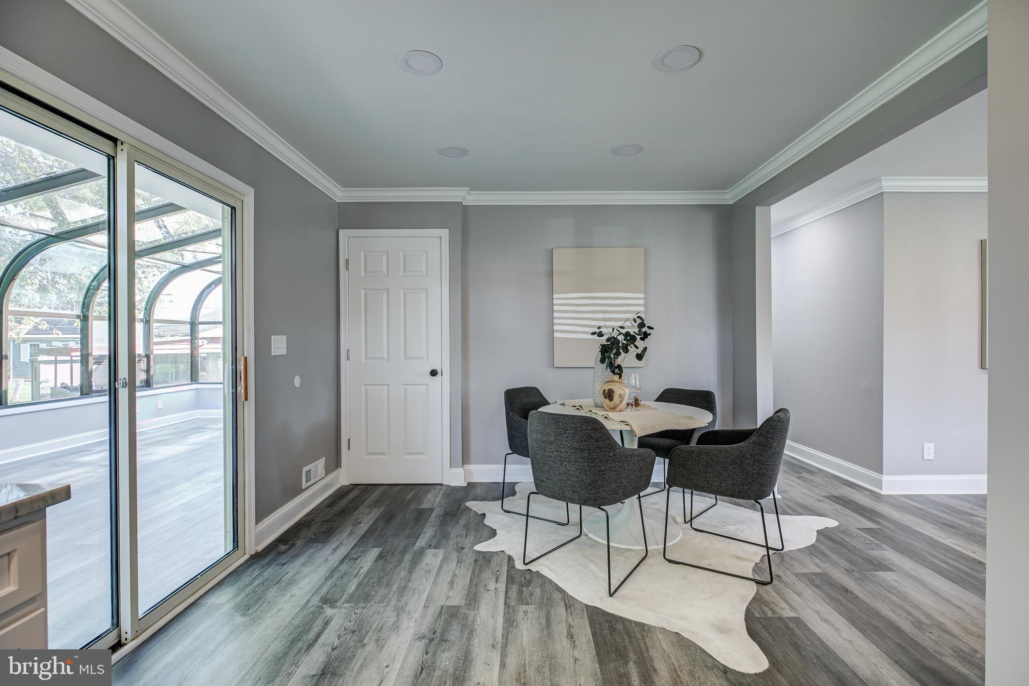 7410 Remoor Road Baltimore, MD 21207 - Photo 10 of 33 a dining room with furniture wooden floor and a rug