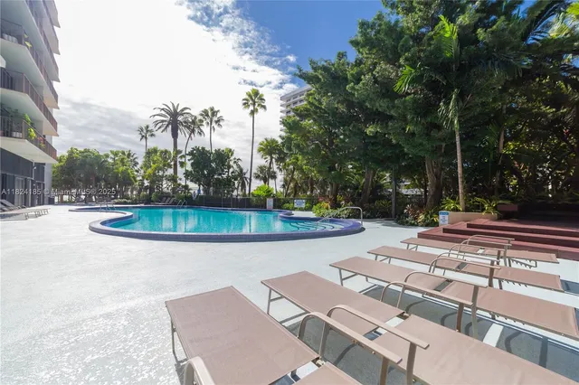 a lobby with furniture and floor to ceiling window