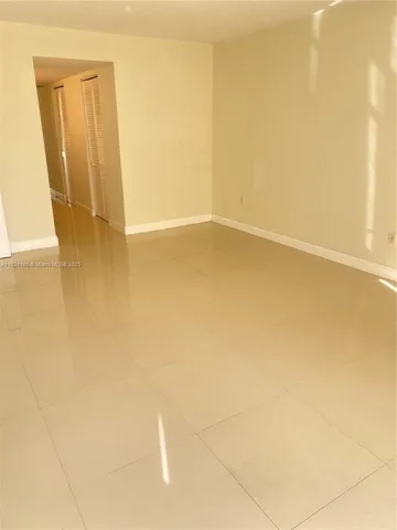a view of a storage and utility room with closet