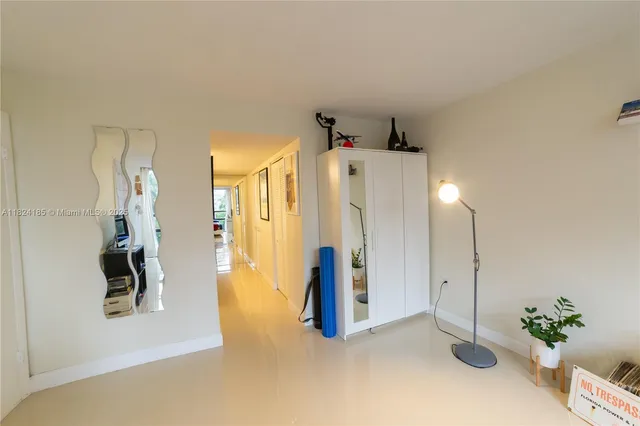 a view of an empty room with glass door