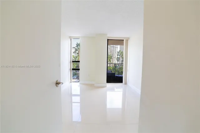 a bathroom with a granite countertop sink a large mirror and a vanity