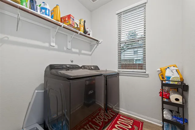 a utility room with dryer and washer