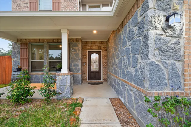 a entryway view with a garden